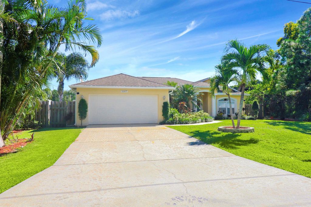 Photo of 2317 SE Rock Springs Drive, Port Saint Lucie, FL 34952 (MLS # R10916547)