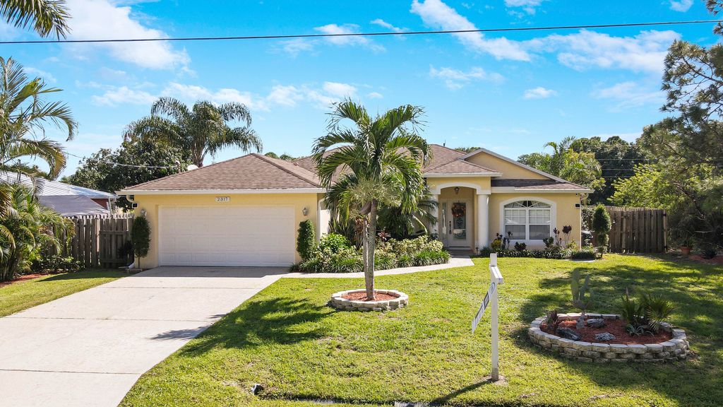Photo of 2317 SE Rock Springs Drive, Port Saint Lucie, FL 34952 (MLS # R10916547)