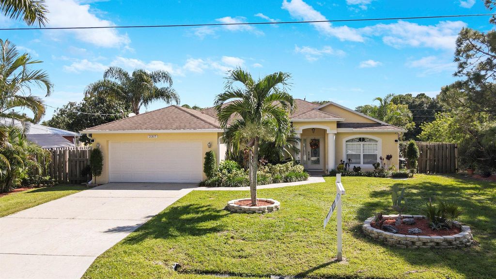 Photo of 2317 SE Rock Springs Drive, Port Saint Lucie, FL 34952 (MLS # R10916547)