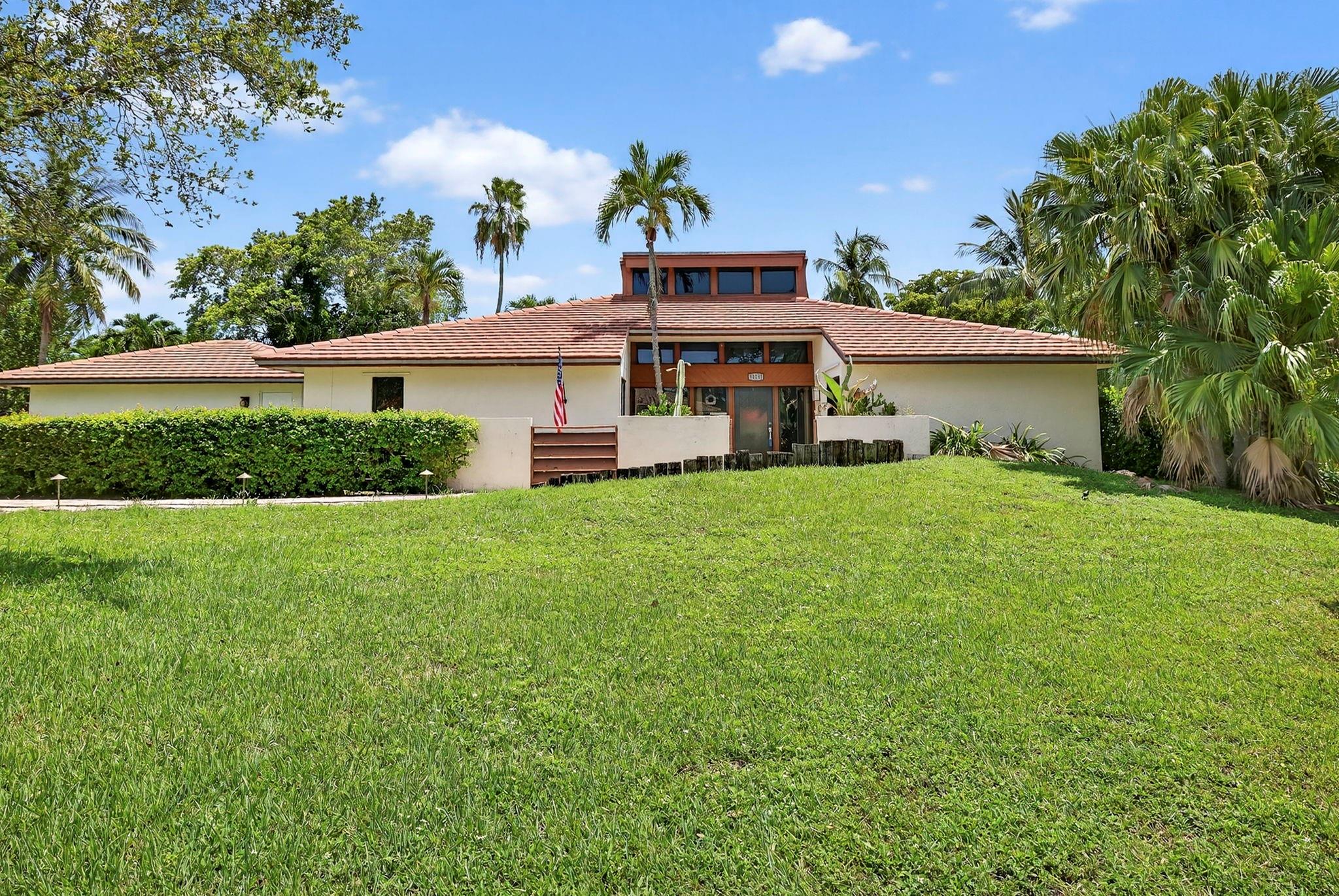 One-of-a-kind retreat in Coral Springs Country Club! Features great room with soaring vaulted wood beamed ceiling. 48x24 tile flooring. Wet bar. 2 newer A/C units. Impact doors & windows. Remodeled master bathroom with new vanity & lighting and his & her walk in closets. Covered concrete patio. Large pool. Fenced yard with sprinkler system. No HOA. Kitchen with newer refrigerator, granite counter tops & wood shaker style cabinets. Dining area off the kitchen. Laundry room. Lots more! Don't miss it!