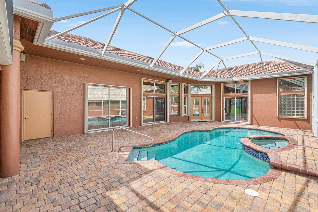 Photo of 10599 Saint Thomas Drive, Boca Raton, FL 33498 (MLS # B26083971)