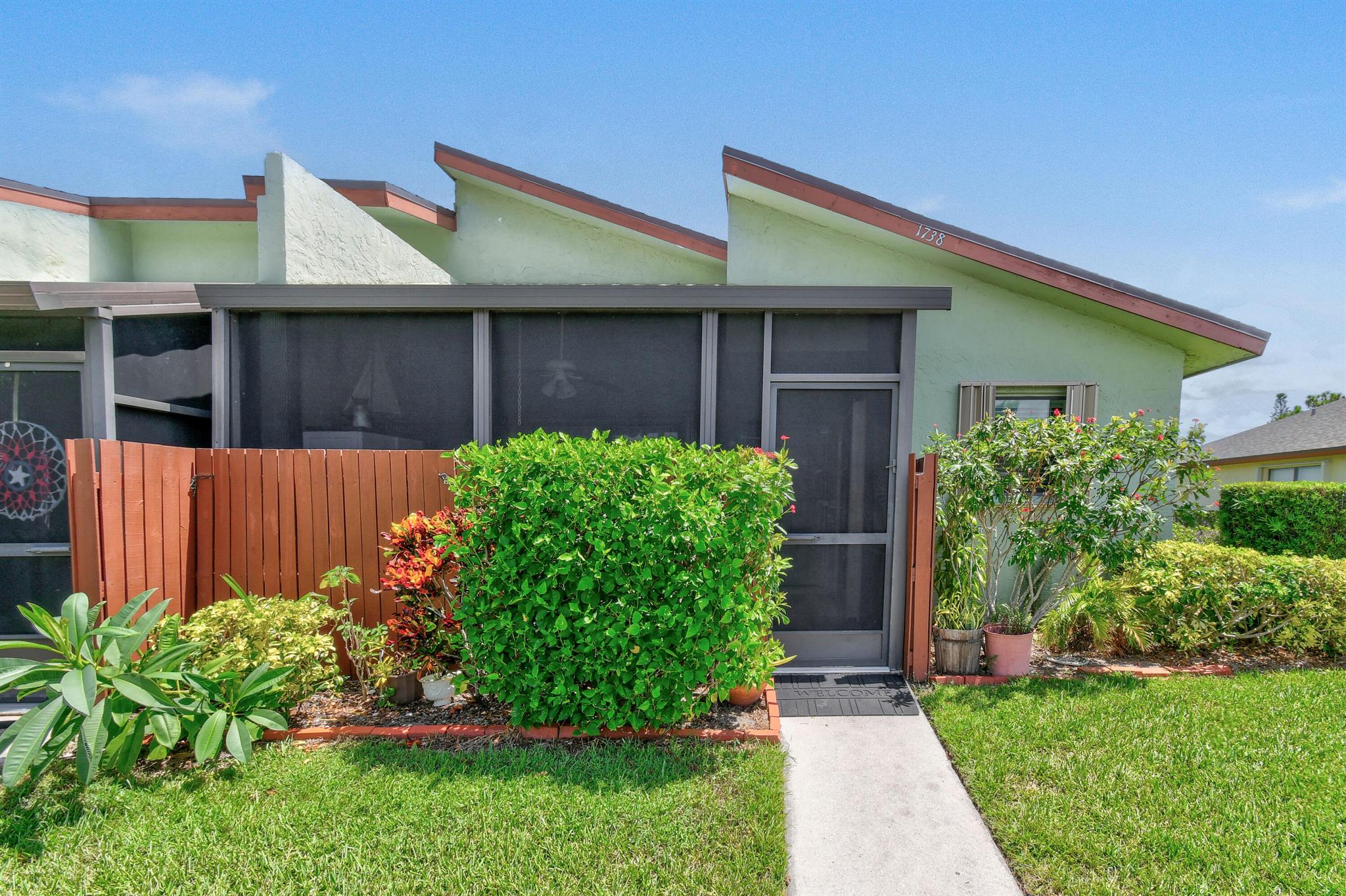 This clean and well-maintained unit in the Savannahs Condominium offers a screened front porch, 2 bedrooms and 2 full bathrooms, with a thoughtful mix of finishes throughout. The kitchen and bathrooms feature tile flooring, while the living room is accented with warm laminate wood, and the bedrooms are comfortably carpeted. Recent updates include a newer A/C system installed in 2020 and a roof replacement completed the same year, and Newer Kitchen Appliances providing peace of mind for years to come. Partial accordion shutters add an extra layer of storm protection, making this unit both practical and inviting.
