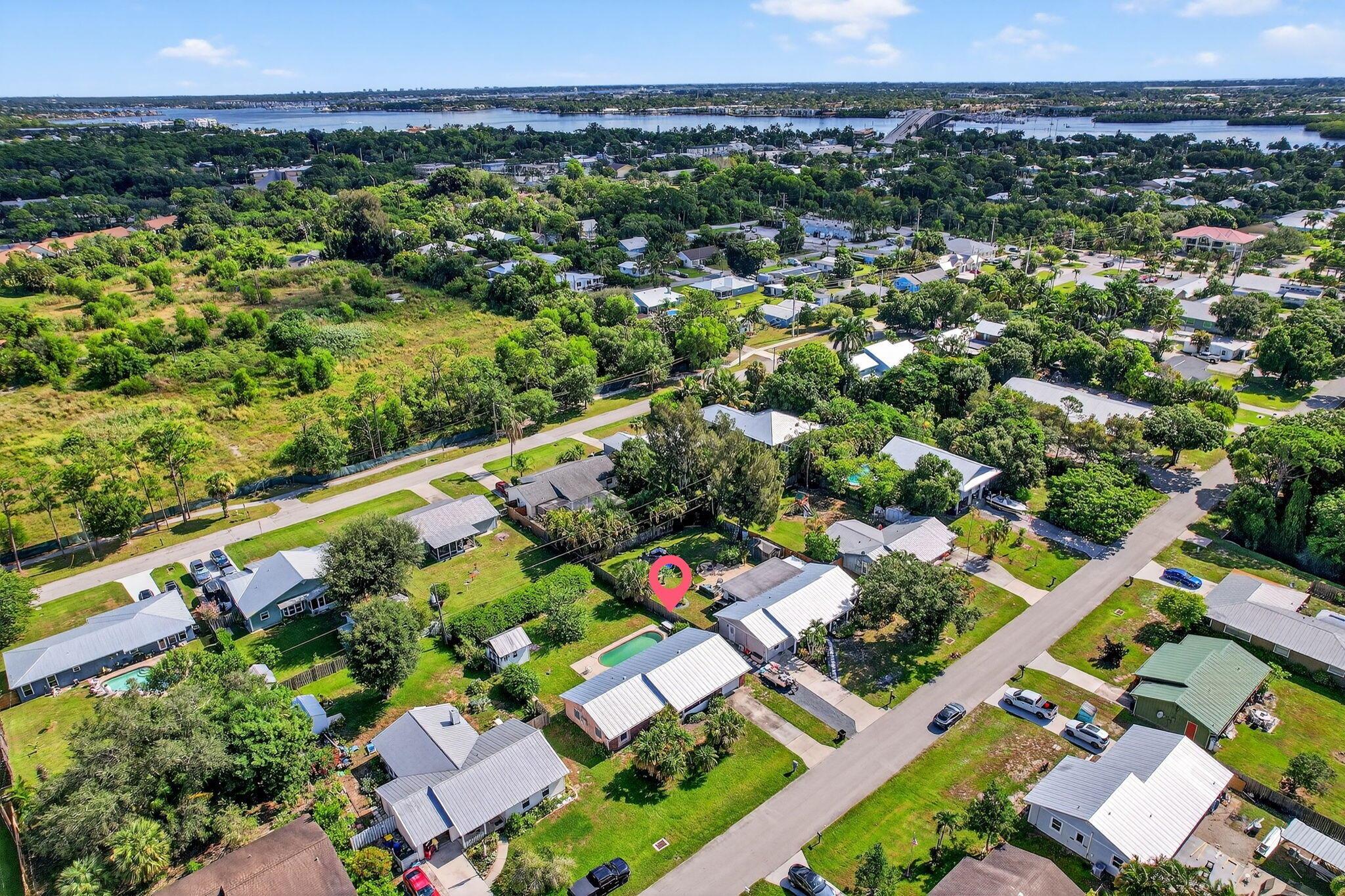 Welcome to this inviting 3-bedroom, 2-bathroom pool home in a fantastic Palm City location! Recent updates include a 2021 metal roof, a 2025 hot water heater, a new well (2022), and a 1-car garage with a new garage door (2022). Hurricane panels provide added peace of mind, while the bright and spacious layout makes everyday living and entertaining a breeze. Step outside to your private pool and enjoy the perfect setting for relaxing or hosting friends and family. Ideally located near the Palm City Bridge, this home is just minutes from downtown Stuart, US-1 shopping and dining, great golf courses, and top-rated Palm City schools. A wonderful blend of comfort, convenience, and the best of Florida living!