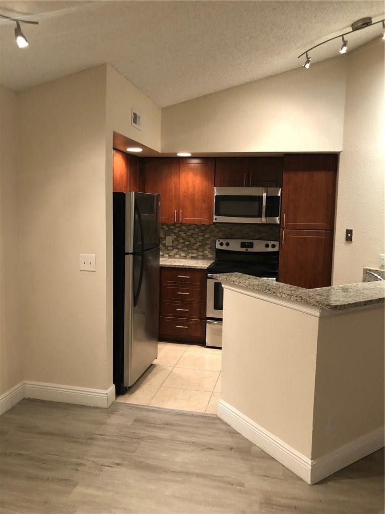 Photo of 12400 Vista Isles Drive #1421, Sunrise, FL 33325 (MLS # B26063521)