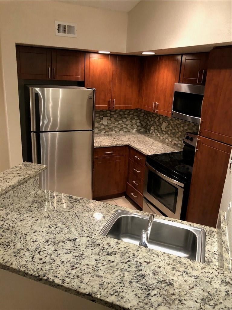 Photo of 12400 Vista Isles Drive #1421, Sunrise, FL 33325 (MLS # B26063521)