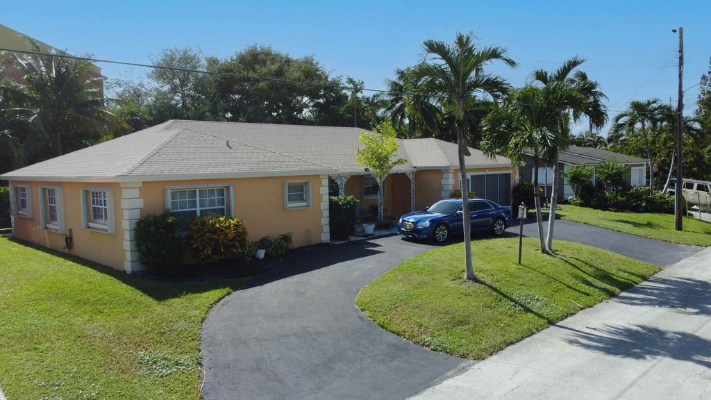 Photo of 310 Wilma Circle, Riviera Beach, FL 33404 (MLS # R11137067)