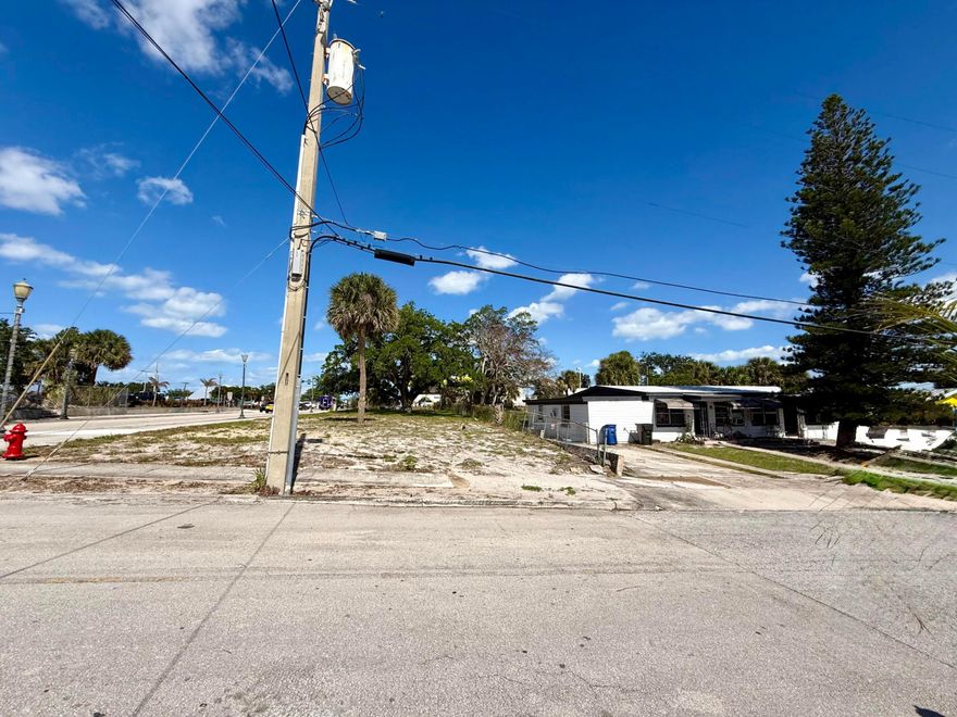 Income-producing opportunity on a half-acre General Commercial corner! This 2,266 sq ft concrete block duplex and adjacent corner lot is  just half a block east of US-1, offering exceptional visibility and future development potential. The 3/2 unit rents for $2,550/mo and the 2/1 unit for $1,500/mo — with one tenant in place since 2011. Electrical meters and breaker boxes replaced approx. 5 years ago; ceilings insulated approx. 4 years ago. Collect rent now, convert later — think restaurant, offices, retail, and more. A solid hold with serious upside.  Only a couple of blocks from planned mega development-Kings Landing.  Within 1 block -New Phatz Restaurant and new Holy Family Veterinary Hospital.  Near Historic Downtown Fort Pierce and City Marina.  Note that interior of sq footage of each unit is only an estimate however tax records show total interior sq footage of both units at 2,054 sq ft.  Taxes for the duplex are $4,547 and taxes for vacant adjacent corner commercial lot are $386