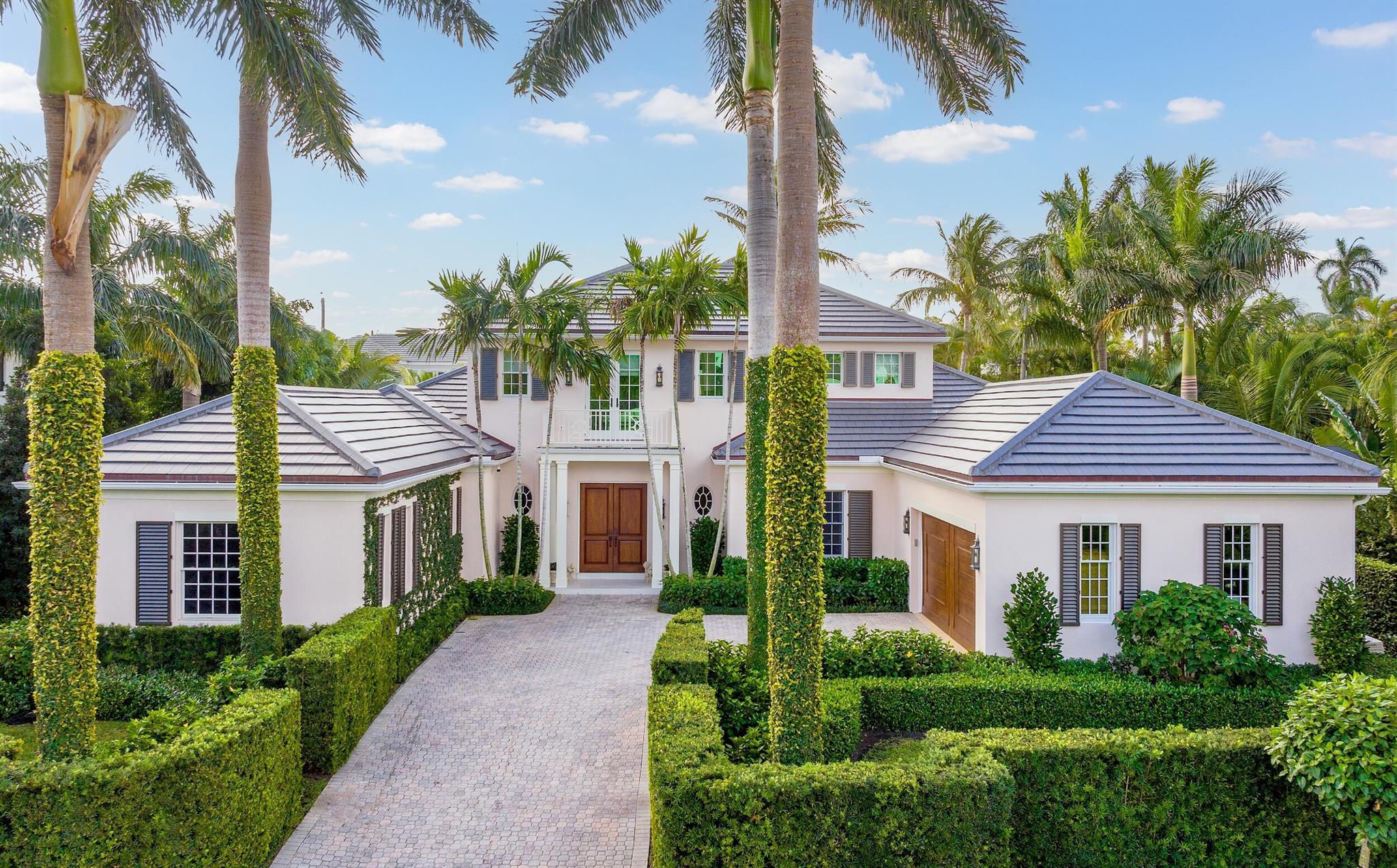 Gorgeous quintessential Palm Beach home with 5BR/5.1BA plus library. Fabulous Near North End location on a sunny South Side lot. First floor Primary Suite features dual walk-in closets and spacious bath. Glamorous entry foyer welcomes you to the light and bright living room perfect for entertaining. Elegant formal dining room and beautiful eat-in kitchen with chef's island. Breakfast area features banquette and panoramic window overlooking serene pool and backyard. Beautiful landscaping surrounds fantastic outdoor spaces including open patio, balconies, and pool with spa.