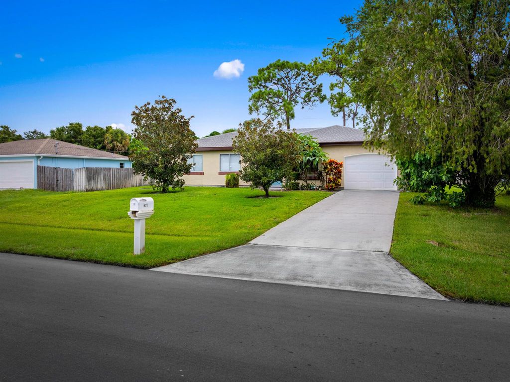 Photo of 671 NW Sharpe Street, Port Saint Lucie, FL 34983 (MLS # R11120104)