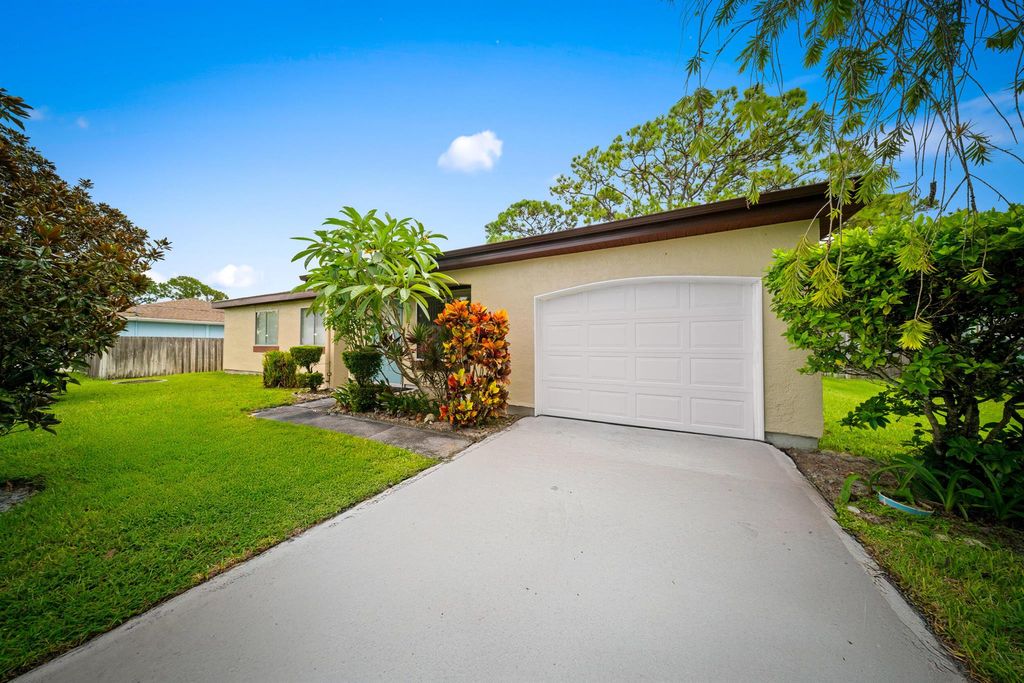 Photo of 671 NW Sharpe Street, Port Saint Lucie, FL 34983 (MLS # R11120104)