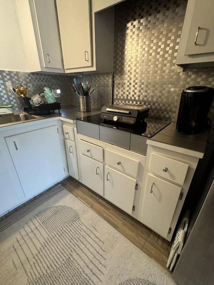 This charming third-floor condo offers a fantastic opportunity for all ages! Featuring 1 bedroom and 1.5 baths, this unit boasts a bright and open floor plan, perfect for comfortable living. The spacious living area extends to a private, screened-in balcony, ideal for relaxing and enjoying the Florida breeze. The primary bedroom includes an en-suite bathroom, and there's an additional half bath for guests. The community, The Falls at Inverrary, provides resort-style amenities, including a pool, gym, and clubhouse. Located conveniently near shopping and dining, this condo is a perfect blend of comfort and convenience. Don't miss out on this incredible value!