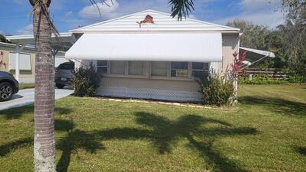 Photo of 33 Camino Del Rio, Port Saint Lucie, FL 34952 (MLS # R10964079)
