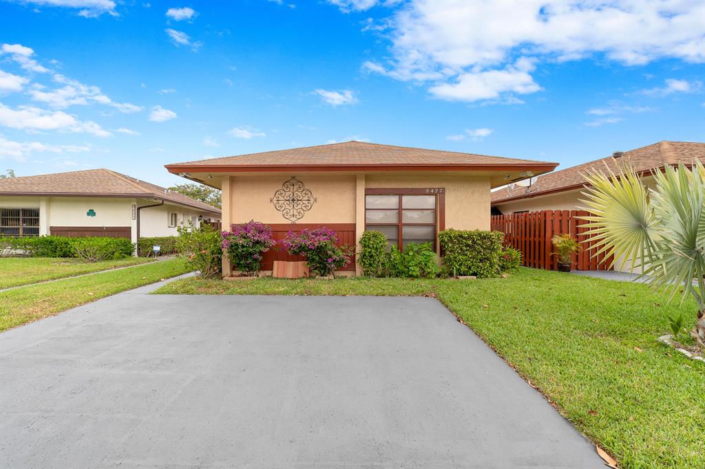 Beautifully remodeled 2 bedroom, 2 bathroom home ideally located on a quiet street overlooking the lake. This home boasts amazing lake views with a fully screened expansive lanai patio area for indoor/outdoor living at its best. The open floor plan allows the light to pour in. Renovated kitchen with wood cabinetry, stainless steel appliances and granite counter tops with a tile backsplash. 18'' Tile flooring is throughout the entire home! Some of the many features include, A/C (2016), water heater (2016) water filtration system and an 8 camera video surveillance system. The low HOA provides lawn care, a community pool and tennis. Centrally located. The home may be under audio and video surveillance at any time. Please make sure to take a look at the 3D Tour / Virtual Walk-Thru of the home!