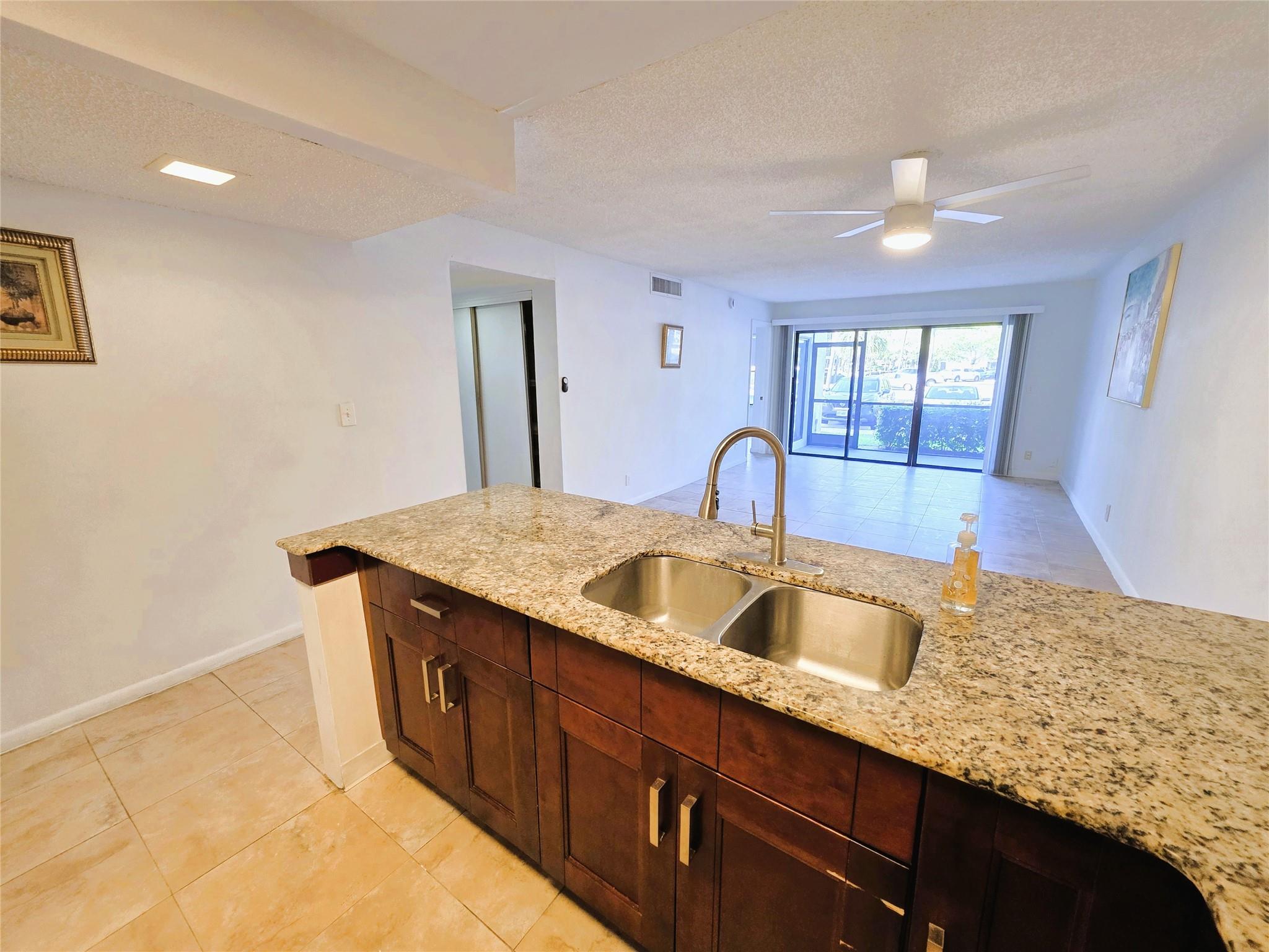 Attention Pickleball & Tennis Lovers, Fitness Enthusiasts & Anyone Who Loves Comfort, Convenience & Quiet Tranquility: Ground Floor Corner Condo w/Parking Right Outside Your Unit Features Resort-Style Amenities, Heated Pools, Sauna, Gym, BBQ, Laundry, Sports Courts, Along w/Shopping, Dining, Casino, TopGolf in Walking Distance! Enter from Lush Courtyard to Open-Concept Kitchen w/Granite Counters, Stainless Appliances, Wood Cabinets. Spacious Great Room. 2 Split Bedrooms w/Adjoining Baths. Plenty of Closet Space. Screened Patio for Relaxing and Bird-Watching w/EZ Access to Parking. Fully Tiled, No Carpet. Freshly Painted, Deep-Cleaned. Short Drive to Beach. All Ages. 1 Dog <40# or 2 <20# Ea. 670 Score, 15% down, No Lease 2 Yrs. LOW FEES. CONCRETE RESTORATION SPECIAL PAID ASSESSMENT IN FULL!