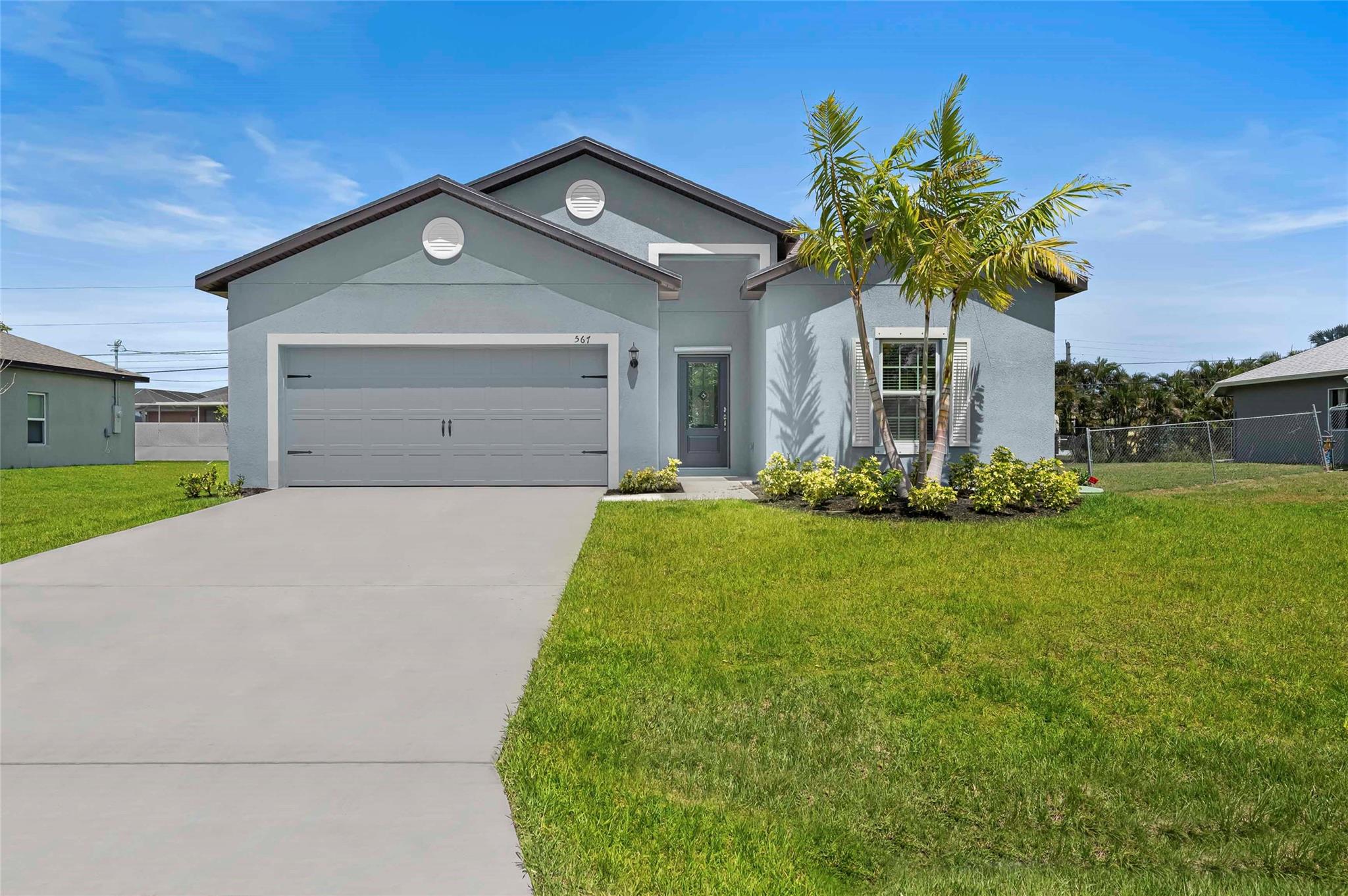 Ask us about our builder paid closing costs & no down payment options! Located within the highly sought-after area of Port St. Lucie, the Coral is more than move in
ready. This one-story home features an open-concept floor plan, 5 bedrooms and 3 full baths
complete with thousands of dollars’ in upgrades included. Features such as energy-efficient Whirlpool®
appliances, sprawling granite countertops in the kitchen, beautiful wood cabinets, brushed nickel
hardware and an attached two-car garage. The Coral also consists of a covered back patio, front yard
landscaping and a master suite complete with a massive walk-in closet. *Appliance models are subject to availability. **Exterior color scheme is as shown in first photo.