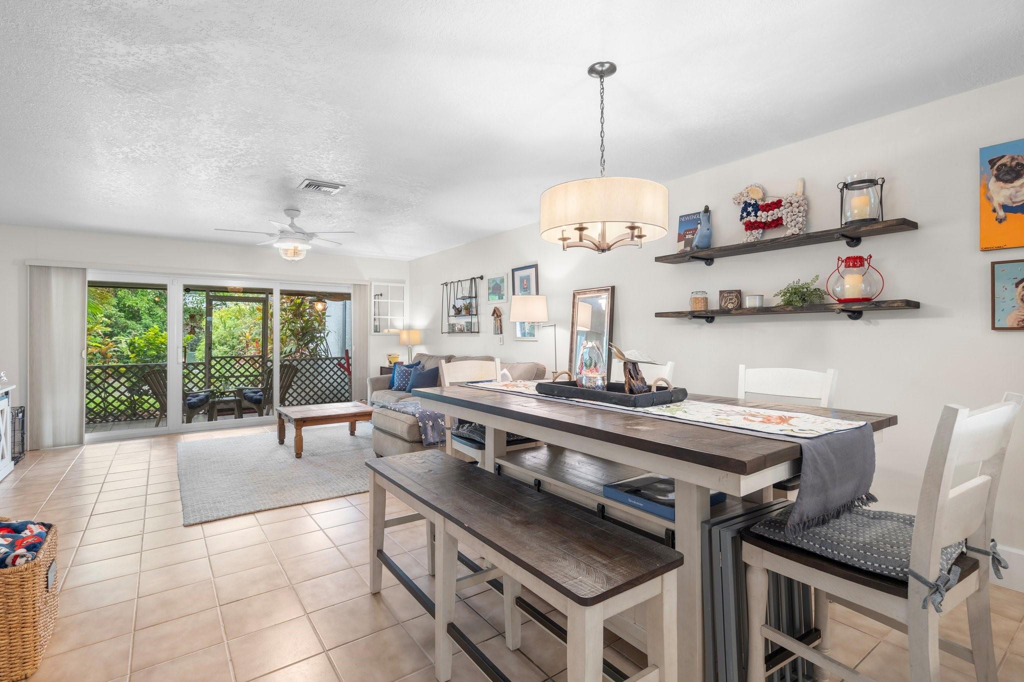 Beautiful 2-BR/2.5BA townhome in desirable Lighthouse Point community, east of US-1. TWO (2) spacious ensuite primary bedrooms. Open-concept kitchen, living & dining areas with tiled floors. HURRICANE IMPACT WINDOWS & DOORS THROUGHOUT. Updated kitchen with granite countertops & stainless-steel appliances. SCREENED-IN PATIO WITH ONE OF THE BETTER GARDEN VIEWS IN THE COMMUNITY & STEPS AWAY FROM THE POOL. NEW A/C (2024). NEW roof (2023). NEW water-heater (2024/2025). NEWLY painted exterior (2025). Full-size washer/dryer in unit. Under stairs storage. Pet-friendly. Amazing location, close to the beach, shopping & dining. Also, a short ride or walk to Dan Witt Community Park (tennis, pickleball, soccer, baseball, basketball, volleyball, kids play area, picnic areas, covered pavilion & more).
