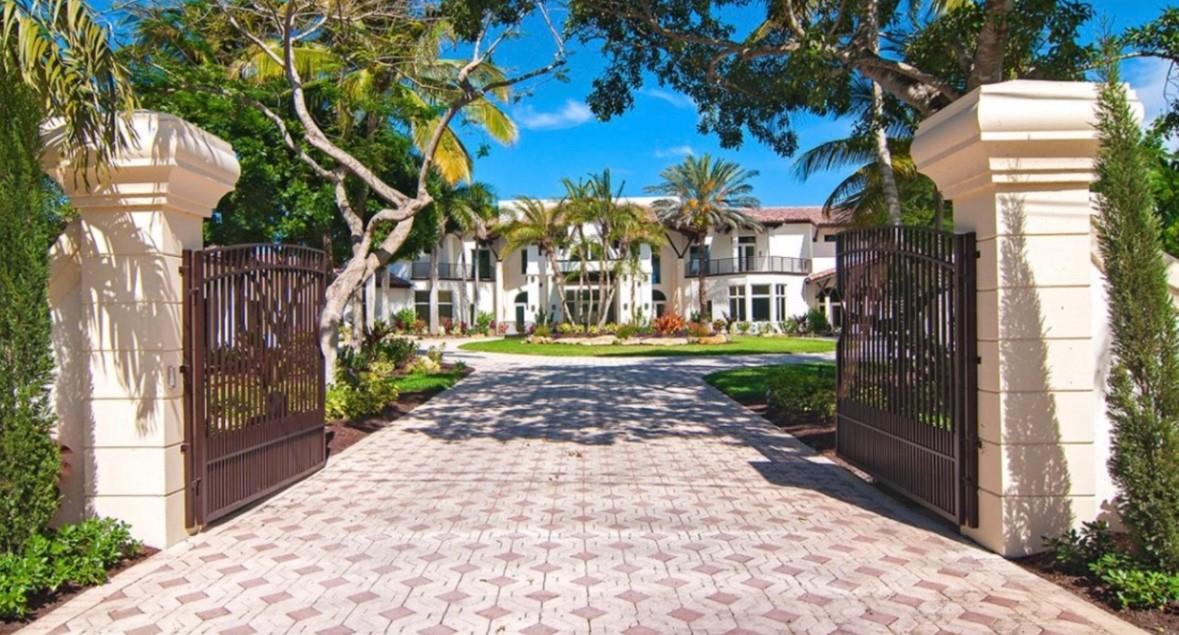 Magnificent mixture of mid-century modern and contemporary architectural masterpiece, 11,794 total square feet on 2.2 acres of private gated compound. Walk in the foyer to dramatic 30 foot ceilings and a 600 gallon jellyfish tank. Hi-end stainless steel appliances, gourmet kitchen, granite countertops, hardwood & marble floors throughout the living area! Large den, office & recreation room. Very nice in-law quarters completely separate from the main house with a full kitchen. The main attraction is the 140,000 gallon swimming pool, jacuzzi with waterfalls with a fire feature, & a swim-up bar. Large windows everywhere, sun filled in every room. Private patios w/ views of pool, land, basketball court, and much more. If you love to entertain this is the home for it, it is your own resort!