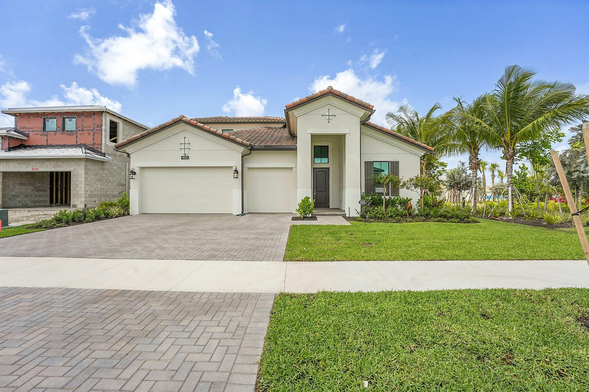 The Paige floorplan, with a pool, is located within the gated community of L'Ambiance at Avenir. This thoughtfully designed home features 4 bedrooms and 4 bathrooms, including a second-floor bonus option that serves as the fourth bedroom and bathroom--perfect for guests or a private retreat. Additional highlights include a 3-car garage and a striking 16' wide by 10' tall sliding impact glass door that opens to the lanai, creating a seamless indoor-outdoor living experience. The owner's suite offers a deluxe shower, an oversized walk-in closet, and a tranquil retreat for rest and relaxation. A versatile flex room provides the ideal space for a home office, gym, or hobby room. The spacious backyard provides ample room for gatherings, gardening, or simply enjoying Florida's sunshine