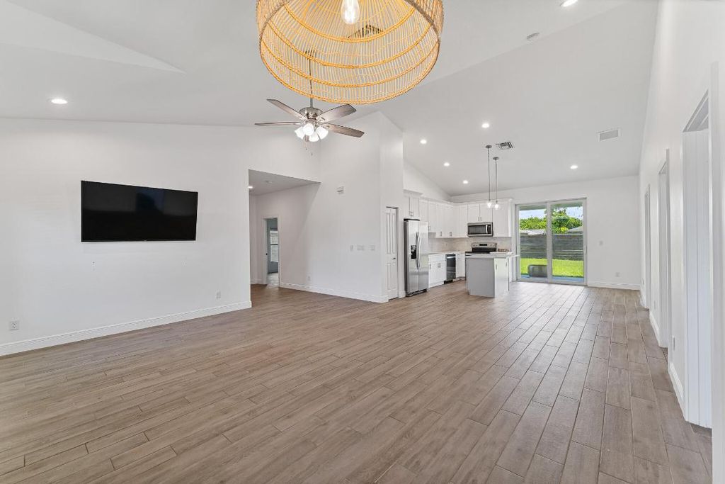 Photo of 1898 SW Idaho Lane, Port Saint Lucie, FL 34953 (MLS # R11002252)