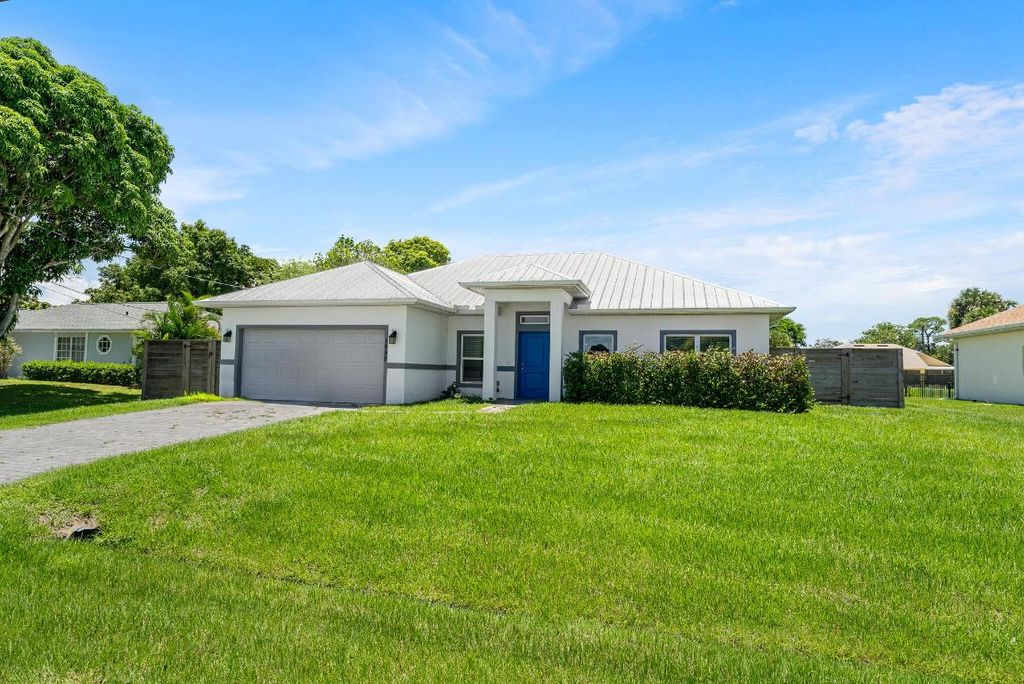 Photo of 1898 SW Idaho Lane, Port Saint Lucie, FL 34953 (MLS # R11002252)