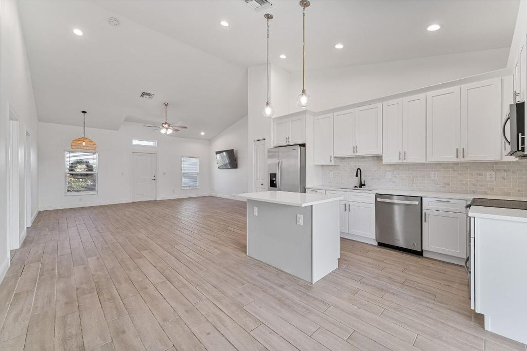 Photo of 1898 SW Idaho Lane, Port Saint Lucie, FL 34953 (MLS # R11002252)