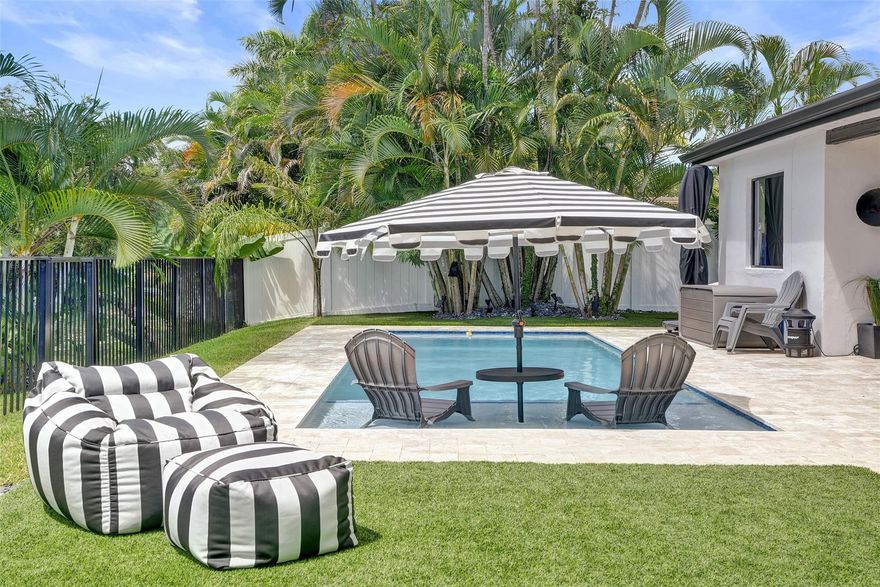 Backyard goals? Check. Imagine diving into your brand-new pool, surrounded by lush landscaping and tranquil water views, with a covered patio made for lazy Sundays and sunset gatherings. This 2-bed, 2-bath waterfront home in Cooper City brings the charm inside too, with a spacious layout that includes separate living, dining, and family rooms. The updated kitchen has granite counters, stainless steel appliances, and French doors that open to keep the view front and center. The primary suite offers a remodeled ensuite bath, while the guest bath is updated as well. Impact windows and doors provide peace of mind, and with no HOA, your boat or RV is welcome. All this on a welcoming tree-lined street, just a short walk to Cooper City schools and minutes from the Turnpike, shops, and dining.