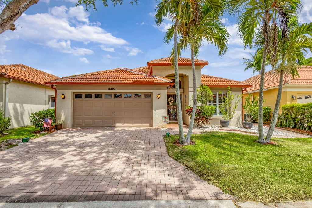 Photo of 5205 Edenwood Road, Riviera Beach, FL 33418 (MLS # R11084042)