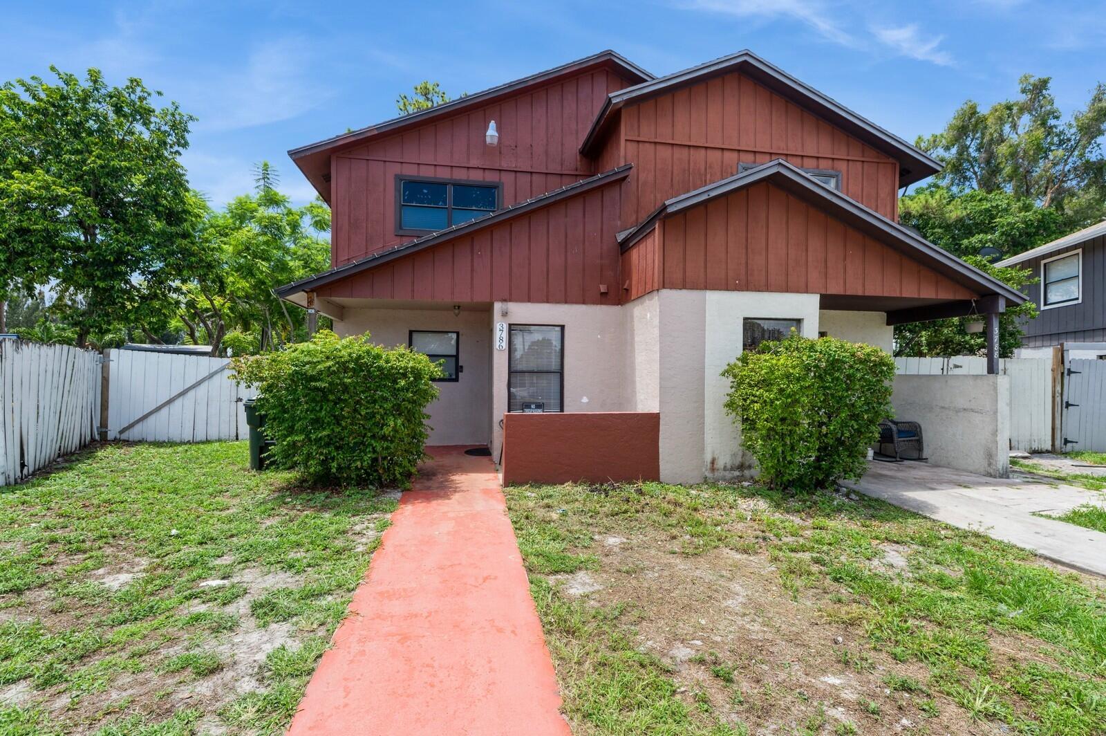 2 story townhome with 2 bedrooms and 1 1/2 baths in central location close to everything. The downstairs has tile flooring in the kitchen, dining, and living room and the 1/2 bath. Kitchen has white cabinetry with granite-look countertops, tile backsplash and a stainless steel range. Both bedrooms are upstairs with the full bath which gives you privacy from the main areas when you are entertaining downstairs. Recently updated laminate flooring upstairs. Unusually large fenced-in backyard with plenty of room for pets or activities.
