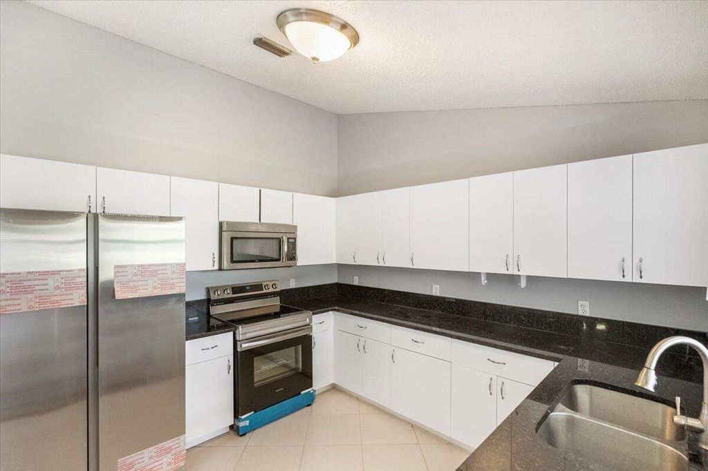 Photo of 2598 SE University Terrace, Port Saint Lucie, FL 34952 (MLS # R10988812)