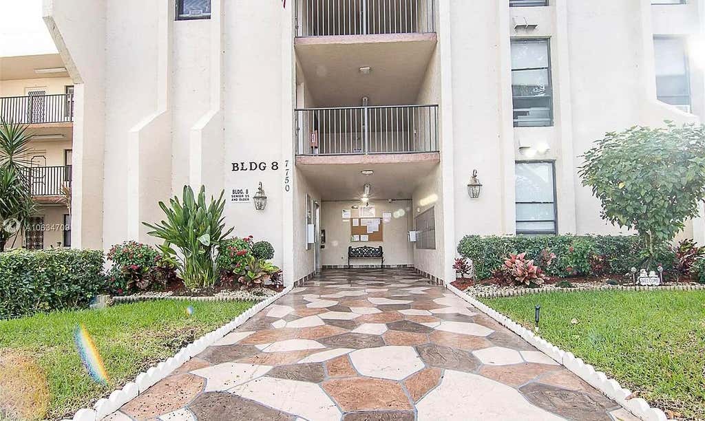 Photo of 7750 W MCNAB Road #316, Tamarac, FL 33321 (MLS # B26061727)