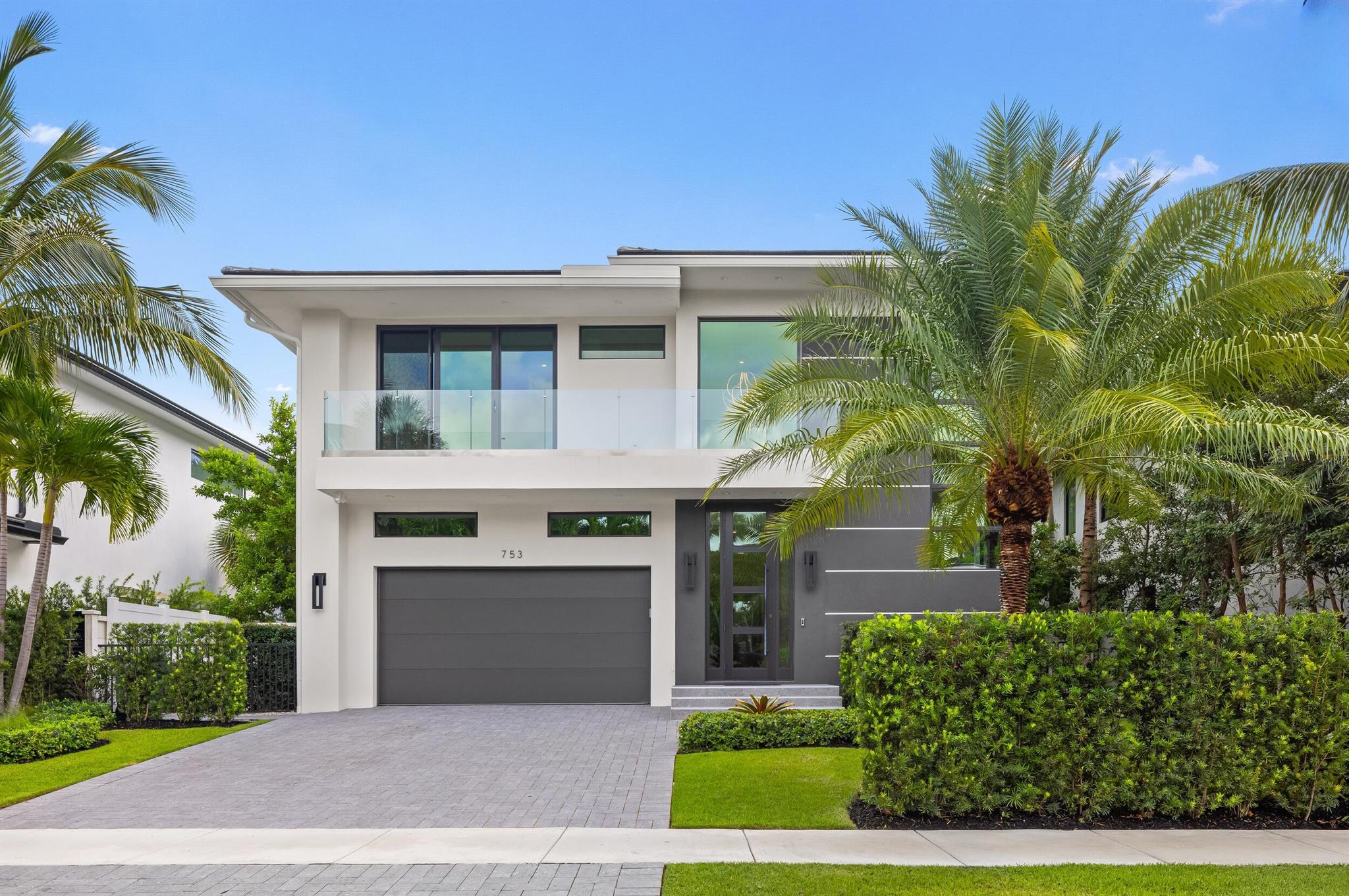 Just two blocks from the beach and within walking distance to the restaurants of Palmetto Park Road and Mizner Park, 753 Park Drive W offers the perfect blend of modern sophistication and timeless coastal living. Built in 2022, this 4,360 square foot residence features four bedrooms, four full bathrooms, and one powder/cabana bath. A thoughtful layout spans two levels, enhanced by a private elevator, dual laundry rooms, and seamless integration between indoor and outdoor living spaces. The first floor is centered around an open concept great room anchored by a spectacular gourmet kitchen with Wolf and Subzero appliances, multiple ovens, and an oversized island. A sleek wet bar, porcelain tile flooring, and a sunlit dining area create a refined setting for entertaining.