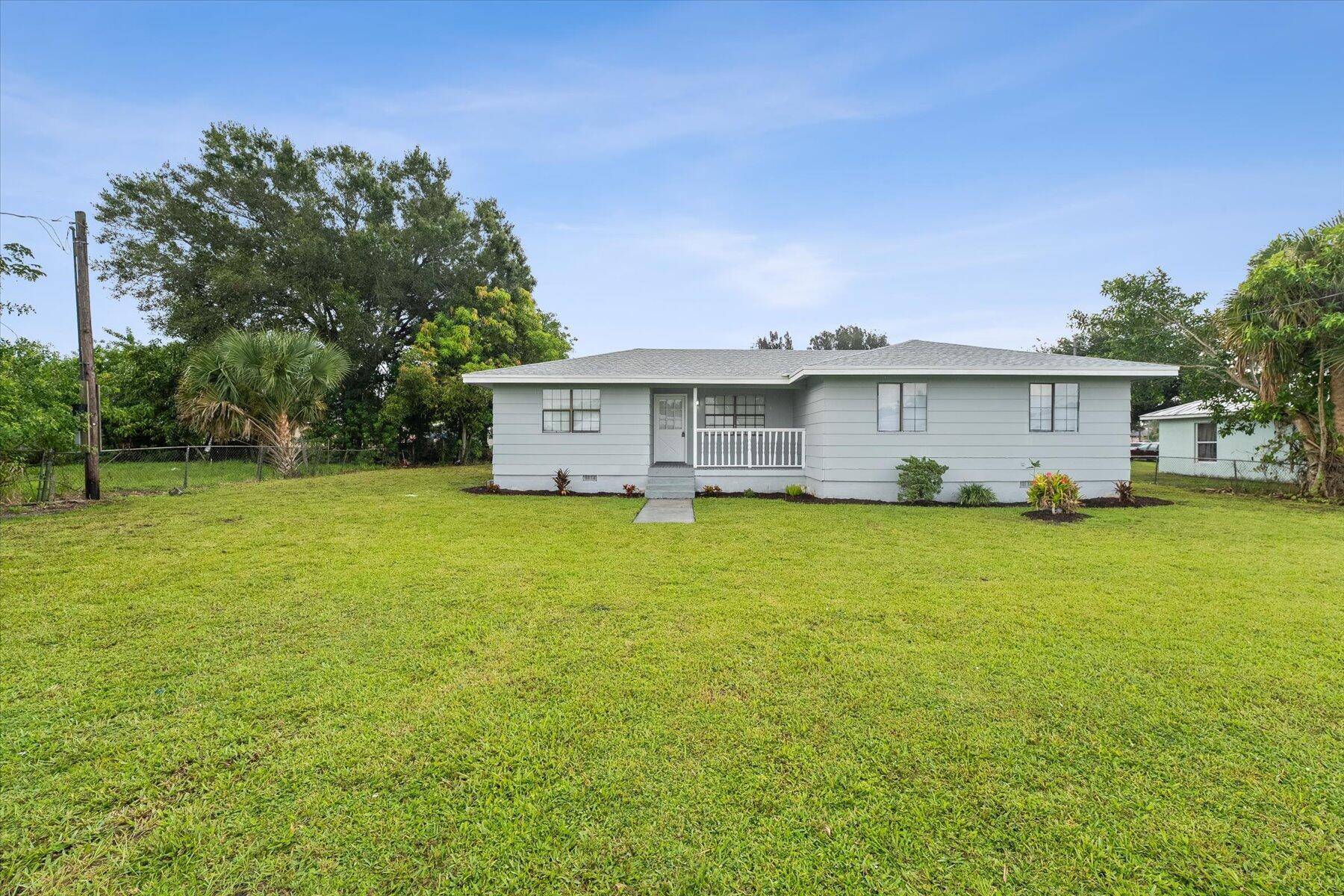 Welcome Home! This charming 3 bedroom, 2 bath single family home is situated on just shy of 1/4 acre and is sure to please. NEW ROOF & NEW A/C! The light and bright floor plan features a newly renovated kitchen with shaker cabinetry, beautiful countertops, a stylish subway tile backsplash and stainless steel appliances. New waterproof luxury vinyl flooring flows seamlessly throughout. Impact windows.Freshly painted interior and updated bathrooms. Move-in ready and waiting for you!