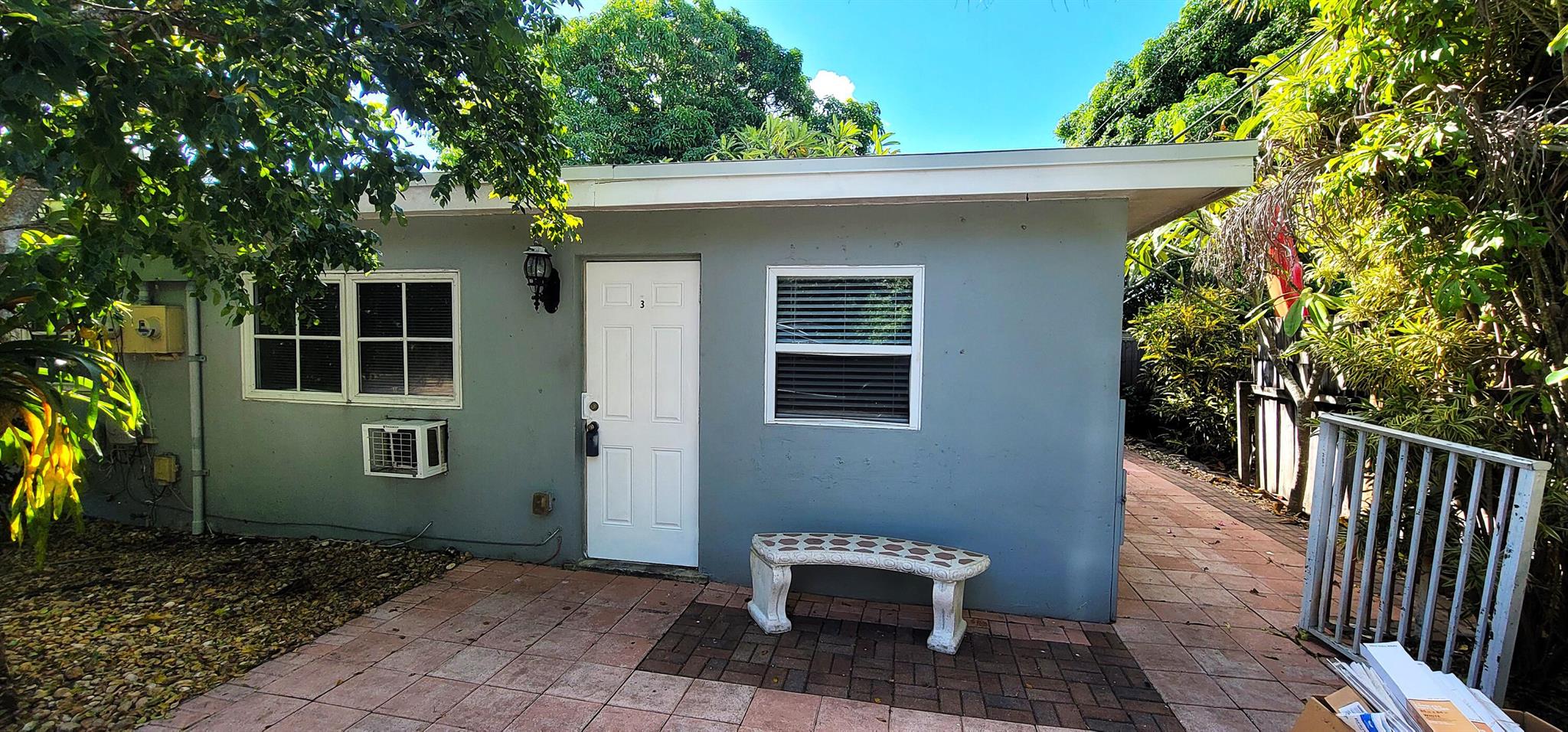 Discover this charming 1BR/1BA mid-century modern apartment tucked away in a peaceful duplex in suburban Lake Worth, just South of 10th Ave North between Military Trail and Congress Ave. This cozy home offers exceptional privacy with your own side and back area -- perfect for relaxing outdoors or enjoying a quiet evening. Inside, you'll find beautiful terrazzo floors throughout and two efficient window/wall A/C units to keep you cool year-round. The unit includes two dedicated parking spaces, and water/sewer/septic is included in the rent -- an excellent value! Ideal for 1-2 responsible residents, this home requires a minimum 650 credit score, verifiable income, and background/credit check is required. Enjoy the timeless mid-century charm, tropical surroundings, and the convenient location