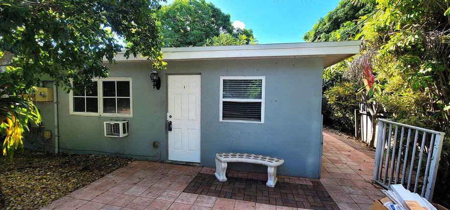 Discover this charming 1BR/1BA mid-century modern apartment tucked away in a peaceful duplex in suburban Lake Worth, just South of 10th Ave North between Military Trail and Congress Ave. This cozy home offers exceptional privacy with your own side and back area -- perfect for relaxing outdoors or enjoying a quiet evening. Inside, you'll find beautiful terrazzo floors throughout and two efficient window/wall A/C units to keep you cool year-round. The unit includes two dedicated parking spaces, and water/sewer/septic is included in the rent -- an excellent value! Ideal for 1-2 responsible residents, this home requires a minimum 650 credit score, verifiable income, and background/credit check is required. Enjoy the timeless mid-century charm, tropical surroundings, and the convenient location