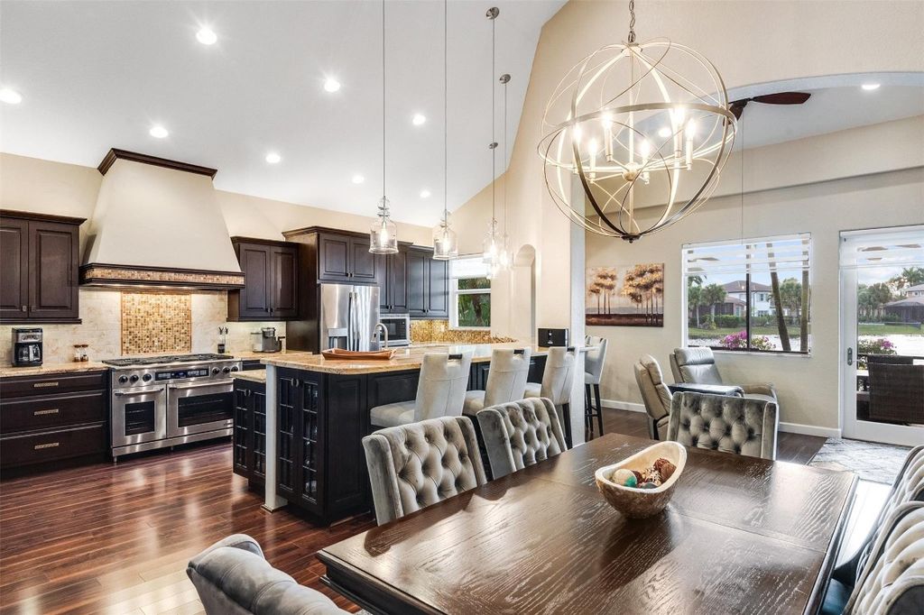 Photo of 12379 NW 77th Manor, Parkland, FL 33076 (MLS # F10463220)