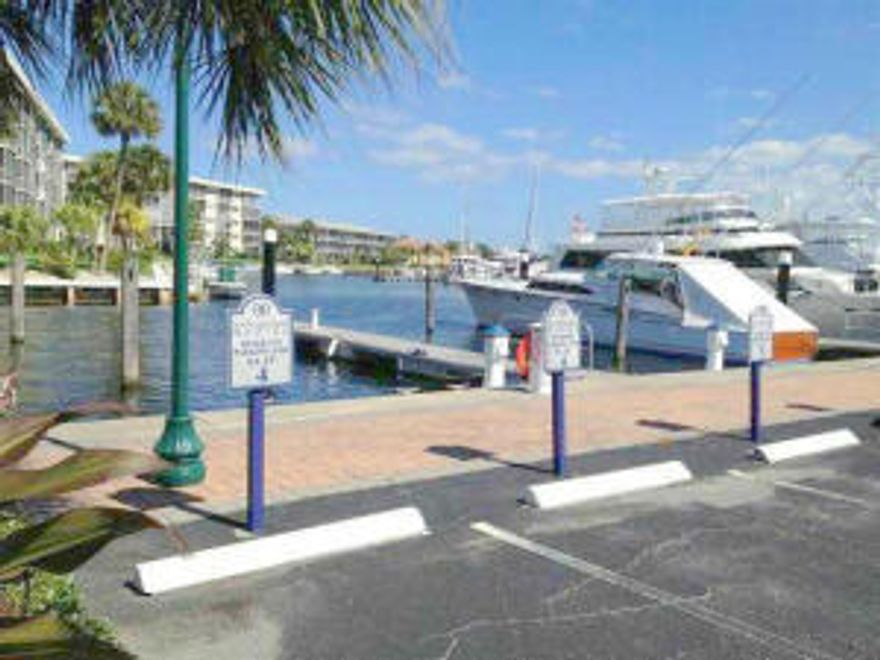 East facing views of the water & marina from spacious patios off Master & Livng area; (Ocean access boat slips 45+ Ft. available for lease from NPB Marina); redesigned open large kitchen with island and tray ceiling;ceramic tile throughout including patio; covered parking = upper level parking space #8 ;full sized cloths washer/dryer; pool and clubhouse; And short walk to North Palm Beach Country Club's Nichlaus signature golf course, with an olympic pool, tennis, restaurant with new club house coming soon;Large (1365+ Sq Ft of living area) plus reasonable leasing and Assoc.rules & fees; surrounded by Intracoastal, marina and golf in North Palm Beach. (Tenant has vacated - now very easy to show - see recent sold comps via drop-down Documents menu)