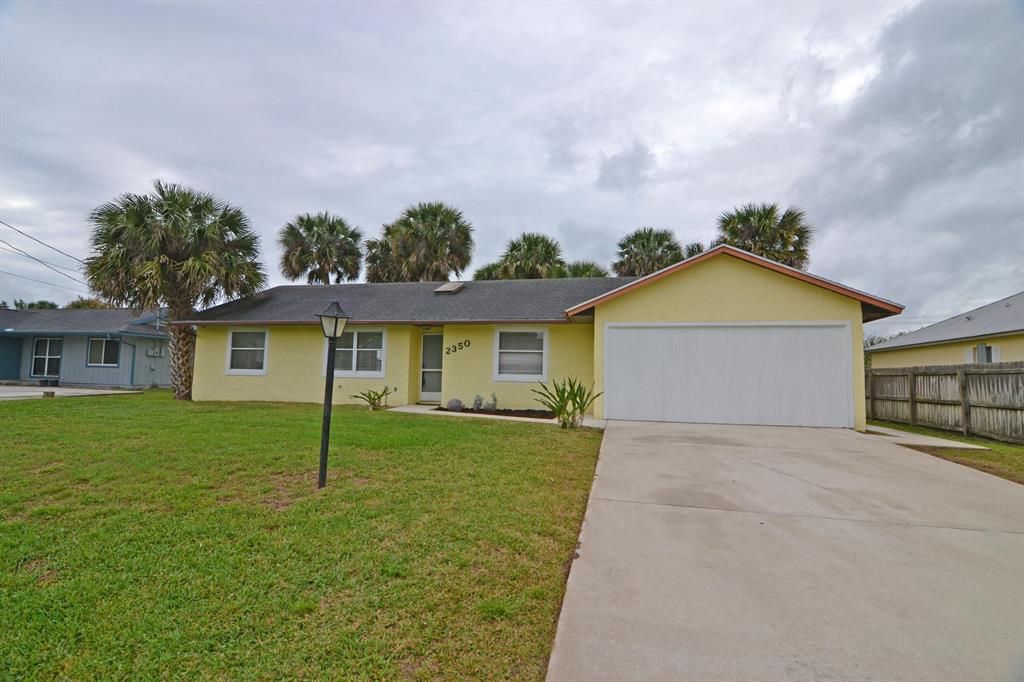 Photo of 2350 SW Woodridge Street, Port Saint Lucie, FL 34953 (MLS # R10741357)