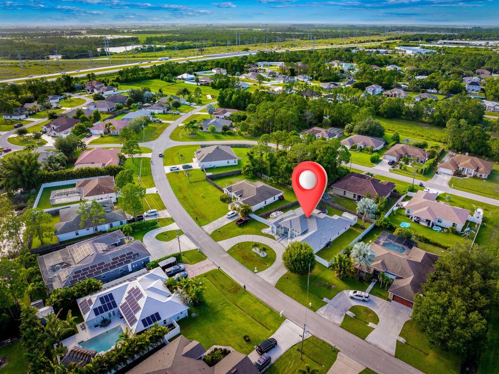 Photo of 5918 NW Hann Drive, Port Saint Lucie, FL 34986 (MLS # R11100049)