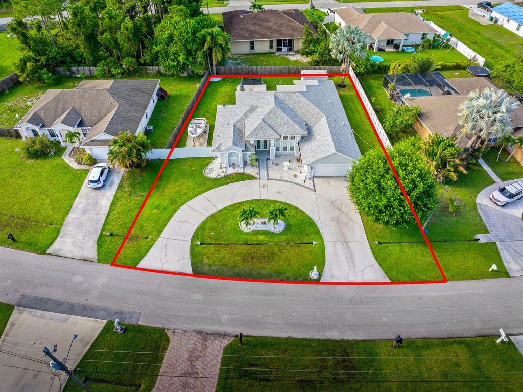 Photo of 5918 NW Hann Drive, Port Saint Lucie, FL 34986 (MLS # R11100049)