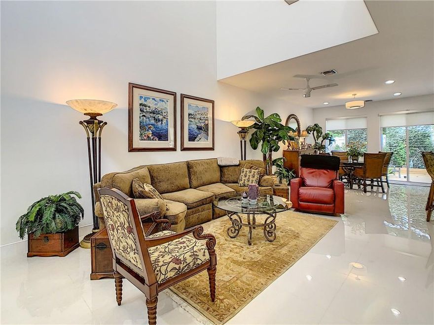 Gorgeous New Construction in Atlantic East.  Unique "Antigua" model, only Antigua that was built as an end unit.  Soaring 20' ceilings as you enter, 5 additional windows on the side help to bring in extra light.  The kitchen was upgraded from the model unit with additional cabinetry, high-end SS appliances "Kitchen Aid", marble backsplash, pot filler.  Custom paint in the upstairs bedrooms.  Largest backyard in the community, completely fenced, and private, lush landscaping, beautiful wood deck. Truly a move-in ready home. Electric car charger installed!