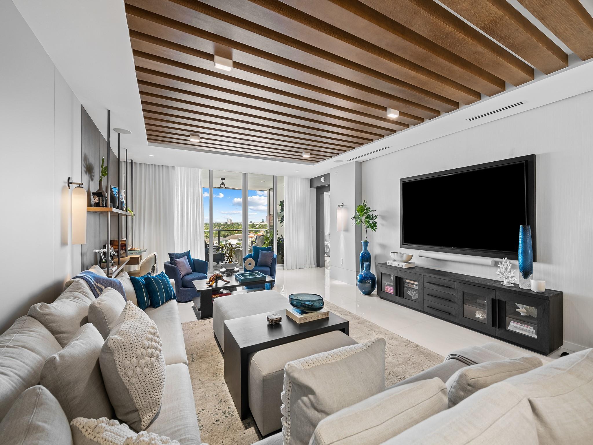 Indulge in elevated waterfront living at  the Adagio. This 3Bed +DEN /3.5BA  flow-through residence offers 180° Intracoastal, city, and ocean views, private elevator entry, and custom finishes throughout. Enjoy soaring ceilings, recessed lighting, tray ceilings, and custom cabinetry/storage. Chef’s kitchen with Gaggenau appliances, gas cooktop, and wine fridge. Oversized terrace features a summer kitchen and incredible wide water views. Each bedroom offers an ensuite bath and private terrace. Wake up to breathtaking sunrises over the ocean and unwind with city lights at night. Offered: fully furnished, AC storage,  and 2 parking spaces. Boutique building with rooftop & sunset pools, gym, and dog walk. Enjoy ultimate privacy with only 29 residences in this exclusive boutique building.