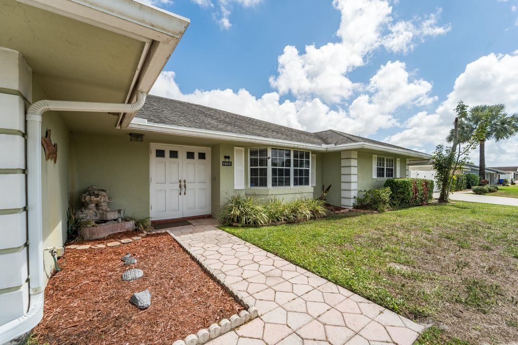Photo of 3194 Pebble Beach Drive, Lake Worth, FL 33467 (MLS # B26002866)