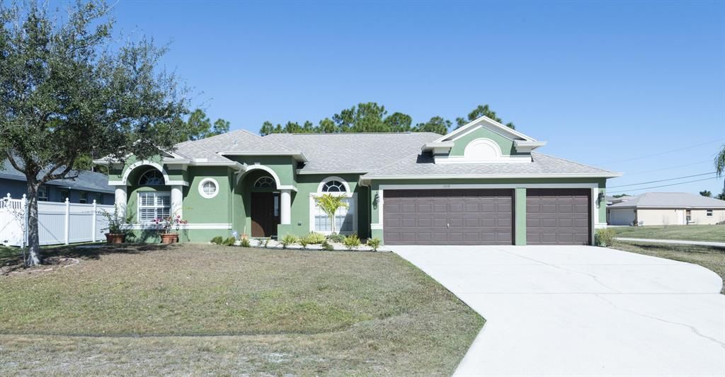 Photo of 5919 NW Favian Avenue, Port Saint Lucie, FL 34986 (MLS # R10690057)