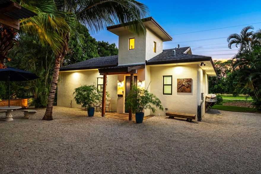 Discover unparalleled elegance in this newly constructed 2023 masterpiece, fully furnished to perfection. This exquisite Wellington residence features soaring 10' ceilings and high-end design throughout, offering 2 luxurious bedrooms and 2 opulent bathrooms. Available for a seasonal rate, this property boasts a quarter-acre of complete privacy and security within a fenced enclave. Step into the grandeur of the tower foyer and be captivated by the sophisticated designer kitchen, ideal for both casual dining at the eat-in counter for four and entertaining in the covered, screened patio. Revel in the resort-like amenities, including two outdoor firepits perfect for evening cocktails, and a hot tub nestled in a tropical paradise.