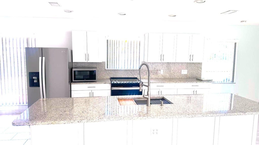 Photo of 8102 PIONEER Road, Royal Palm Beach, FL 33411 (MLS # B26067622)
