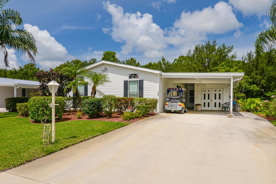 $10K PRICE REDUCTION!!!  This cheerful, well loved home with vibrant colors won't disappoint!  Golf cart & hot tub included, but may need TLC.  Savanna Club offers golf, a cafe, 3 pools, 2 clubhouses, a rec center, theater & so much more!