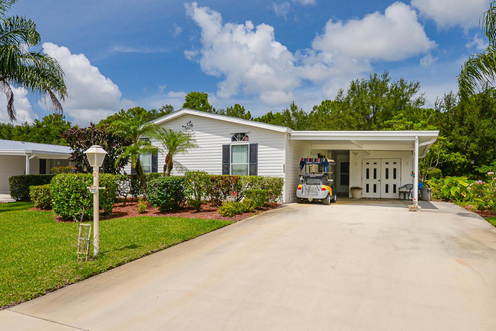 This cheerful, well loved home with vibrant colors won't disappoint! Golf cart & hot tub included, but may need TLC. Savanna Club offers golf, a cafe, 3 pools, 2 clubhouses, a rec center, theater & so much more!