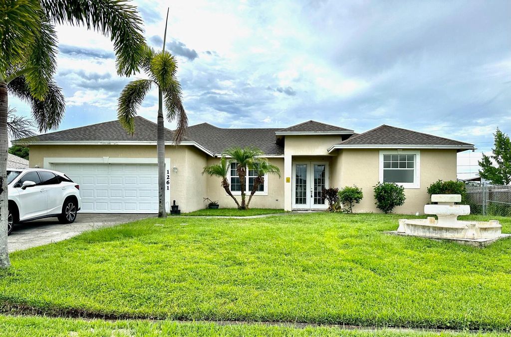 Photo of 1261 SW Santiago Avenue, Port Saint Lucie, FL 34953 (MLS # R11005560)