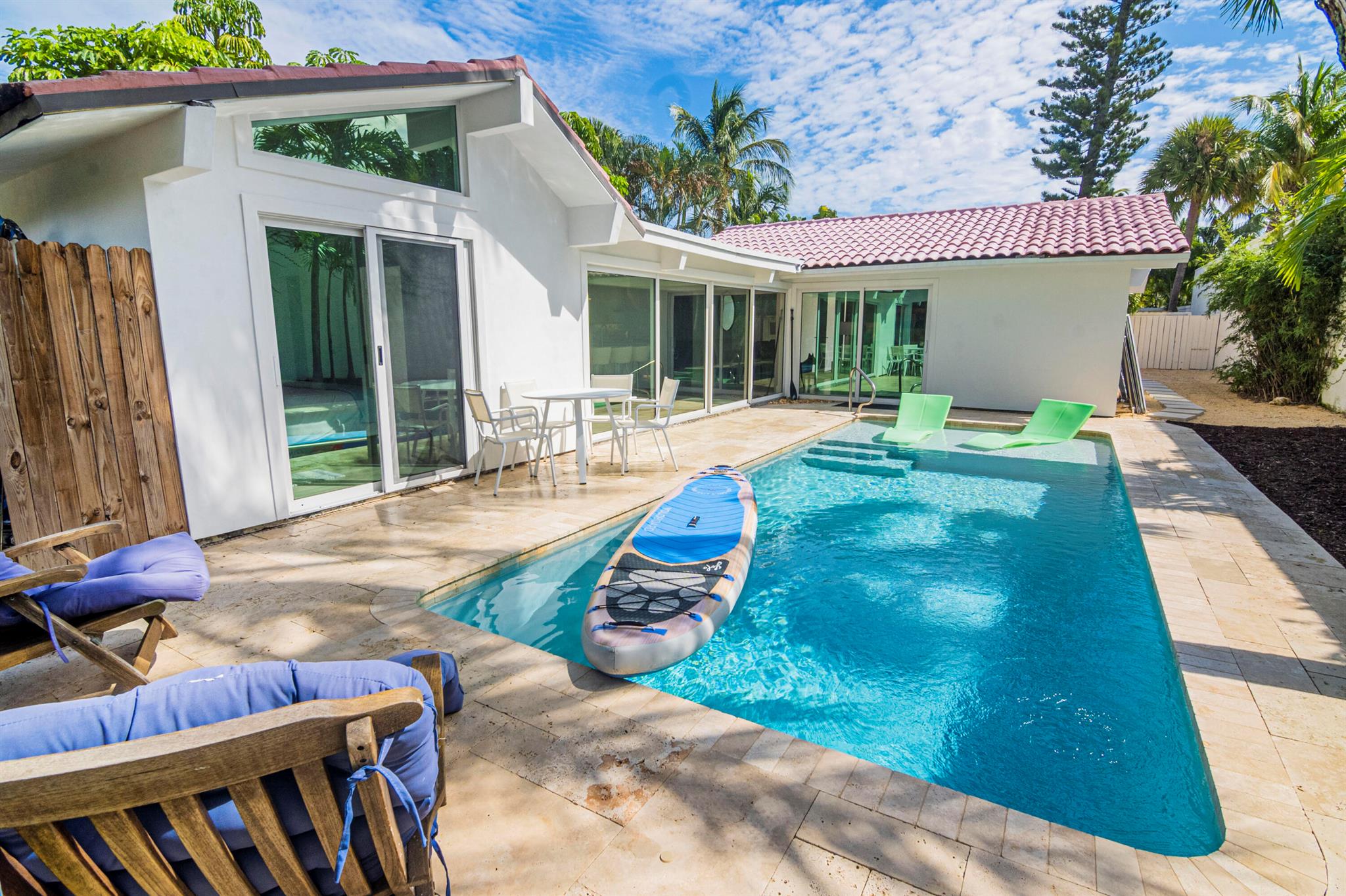 Private pool/spa home in gated community at Jupiter Beach. Totally renovated In a '' salty contemporary'' theme with new tile flooring, impact windows and sliders, Love Sac furniture in living room, prana king and queen mattresses with new linens , dim LED lighting everywhere including under cabinets and island and 4 smart tv's with HBO Max,Youtube and Netflix. Appliances include Profile monogram gas stove top, water filtration and tankless hot water heater provides instant hot water. Owner would negotiate rent price if guest only requires 3 months and or not require use of third bedroom in detached cottage . Outside is private and includes a putting green, gas grill , spa , pool and and fire pit. Added privacy afforded by automatic gate from street to motor court. Available 1/07/2026