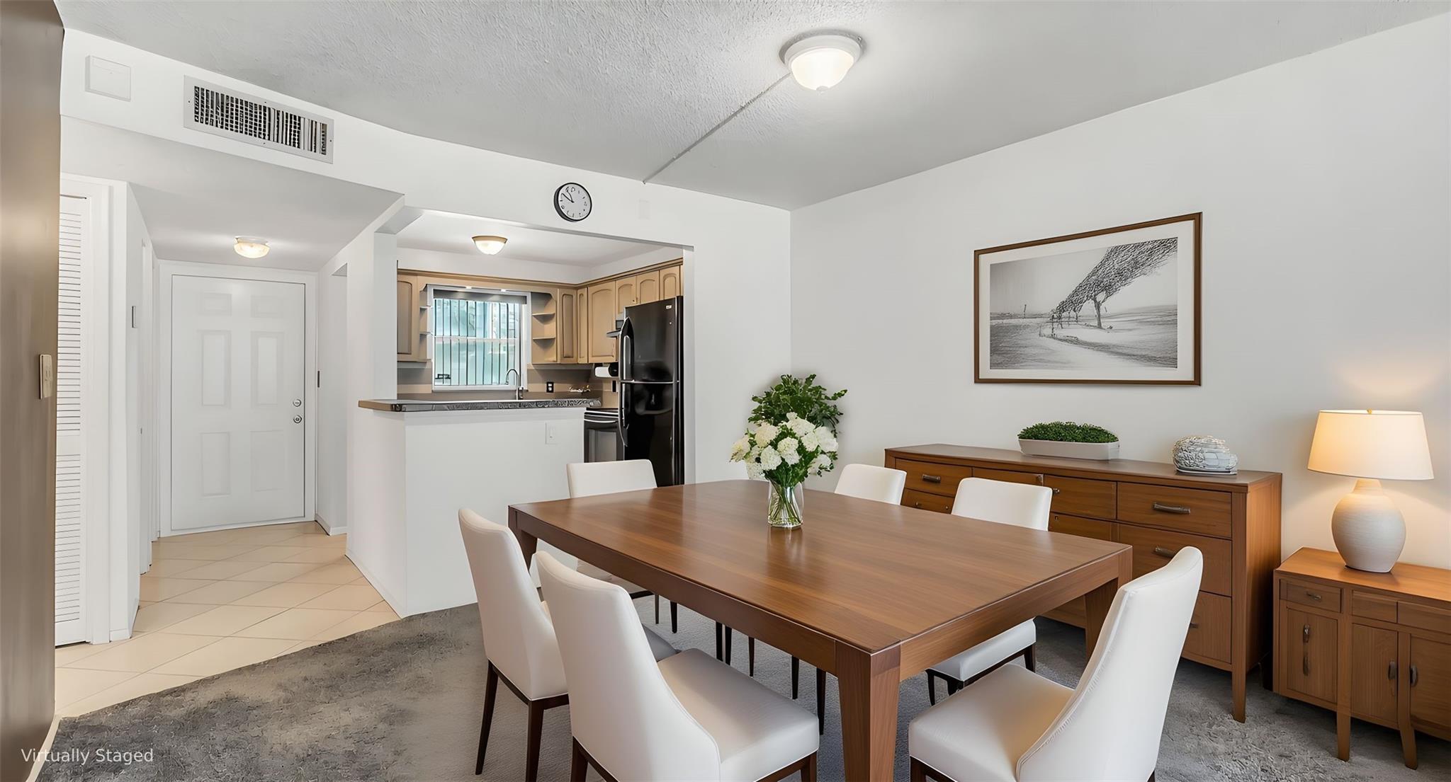 Renovated Corner 2/2 unit with New Kitchen & updated bathroom, Ac 2020 hot water 2018. Discover this charming condo in the heart of Davie, offering both serene lake & private lush garden views. Enjoy a bright kitchen w/beautiful wooden cabinets, complemented by a mix of tile & new carpet throughout. There is Tile under the carpet if you do not like carpet. Step outside to a community that features Pool with peaceful barbecue area, tennis court & tranquil surroundings perfect for relaxation. Conveniently located near shopping, dining, all the Davie Universities & major highways, this home combines comfort with an excellent location! Can be rented first year, Investor friendly, Best deal in Davie. Building has elevator, new roof, new railings, new screen & No assessments, Bldg passed 40 yr